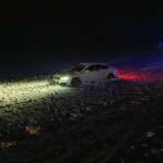 PKW Bergung aus Feld in dichtem Schneefall