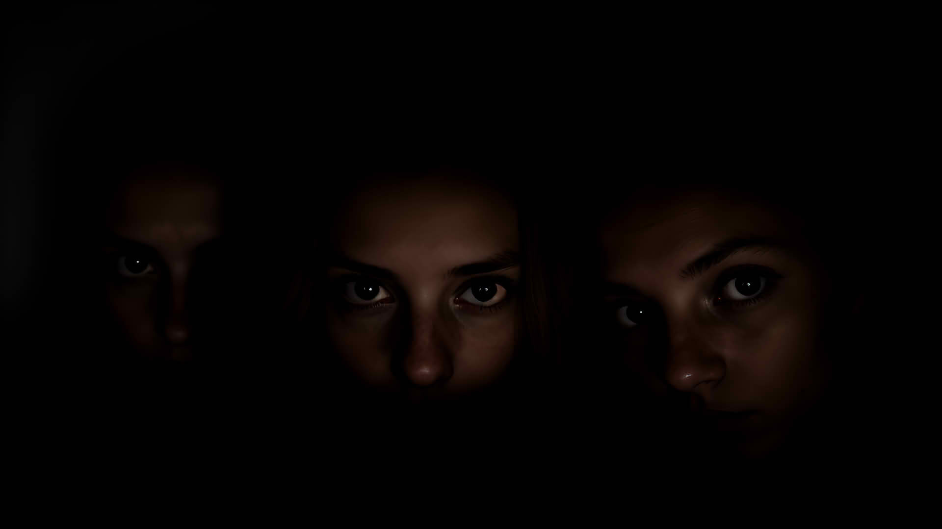 3 Gesichter im Dunkeln whrend eines Blackout